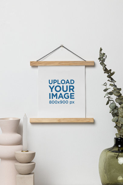 Mockup of a Matte Vertical Poster Hanging on a Wall Featuring Modern Decorations m35725