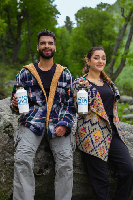 Travel Mug Mockup Featuring a Smiling Couple Hiking on a Trail