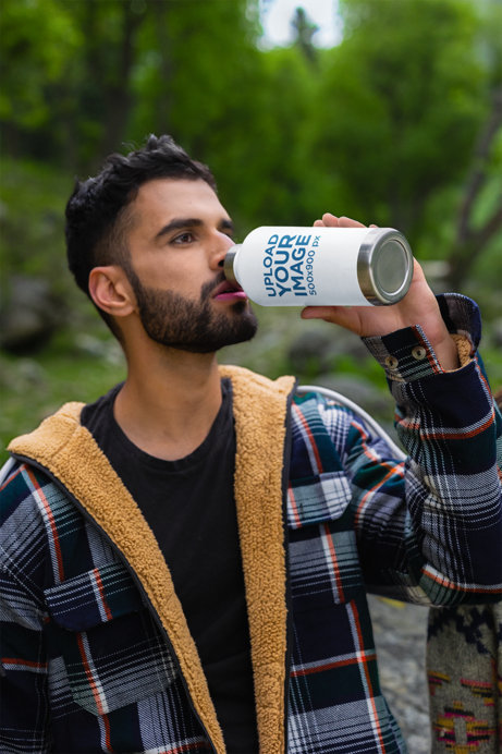 Mockup of a Bearded Hiker Drinking from a Travel Mug