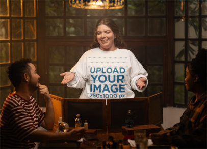 Gildan Sweatshirt Mockup Featuring a Woman Playing Role-play Games with Friends