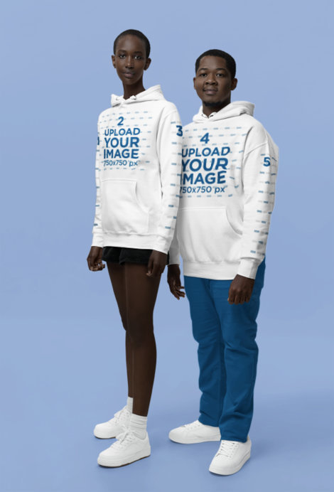 Cotton Heritage Pullover Hoodie Mockup Featuring a Serious Man and Woman in a Studio