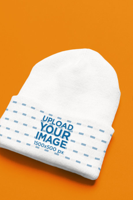 Mockup of a Youpoong Beanie Lying Over a Colorful Surface