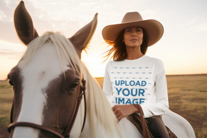 Long-Sleeve Tee Mockup Featuring an AI-Created Woman Riding a Horse in a Western Landscape