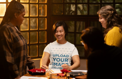 Bella Canvas T-Shirt Mockup of a Joyful Man Playing Board Games with His Friends