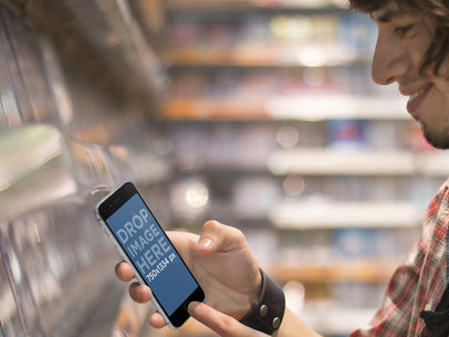iPhone 6 Template Featuring a Young Man Shopping for Video Games