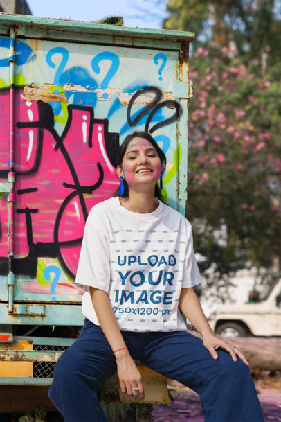 T-Shirt Mockup Featuring a Woman with a Painted Face Ready to Celebrate the Holi Festival m37219