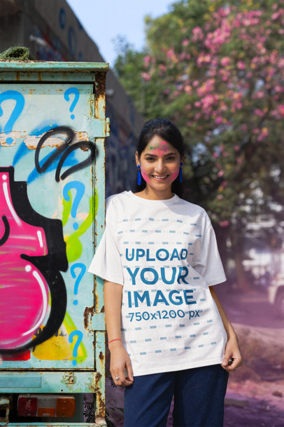 Holi Festival-Themed T-Shirt Mockup Featuring a Woman with Colorful Powders on Her Face