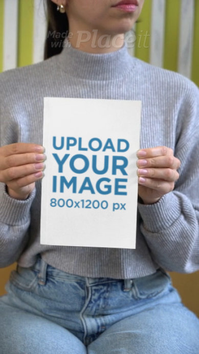 Video of a Cropped-Face Woman Holding a Book