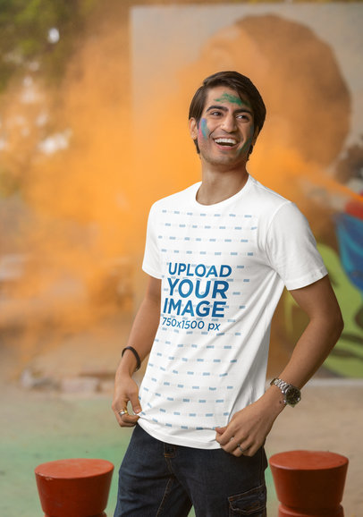 Mockup of a Joyful Man Wearing a Scott International T-Shirt at a Holi Fest Celebration m37267
