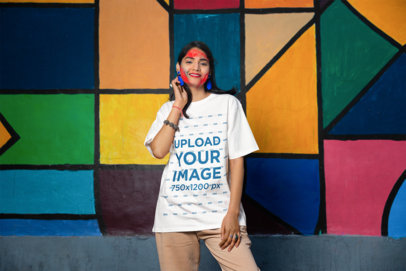 Blinkstore T-Shirt Mockup of a Woman with Color Powders on Her Face for Holi Festival