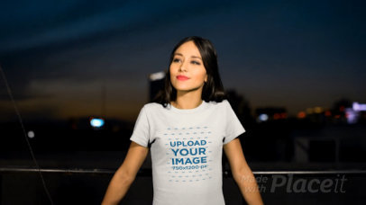 Video of a Pretty Woman at a Rooftop Wearing a Round Neck T-Shirt