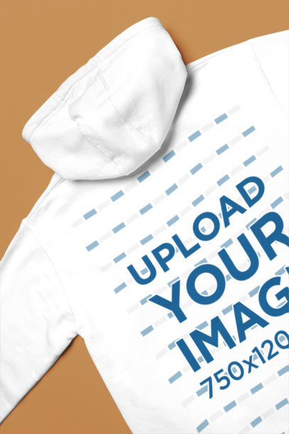 Back-View Cotton Heritage Mockup Featuring a Pullover Hoodie Lying on a Colorful Surface m35299