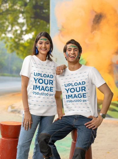 Scott International T-Shirt Mockup Featuring a Happy Woman and a Man Celebrating Holi