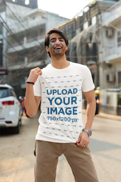 Holi Festival-Themed Mockup Featuring a Man Wearing a Scott International T-Shirt