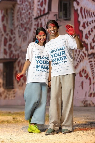 Blinkstore T-Shirt Mockup Featuring a Happy Man and Woman With Painted Hands for Holi Fest m37263