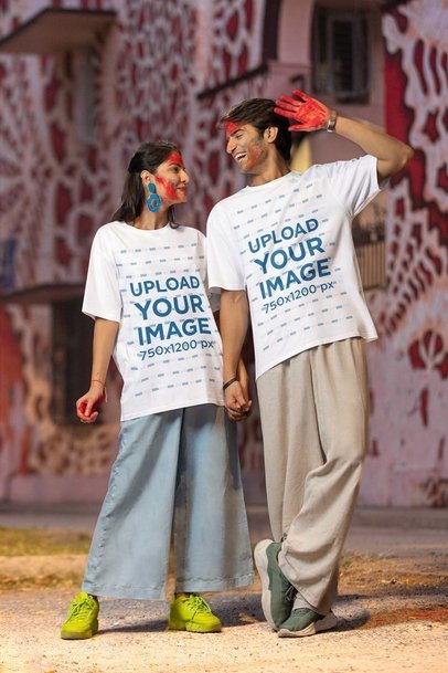 Blinkstore T-Shirt Mockup Featuring a Cheerful Couple in a Holi Celebration