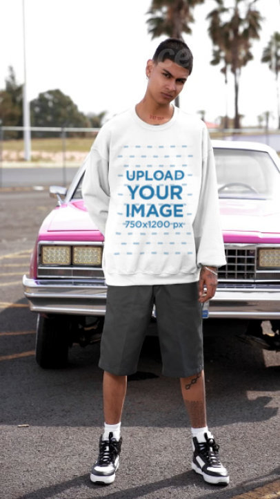 Gildan Sweatshirt Video Featuring a Serious Man Posing Against a Pink Car
