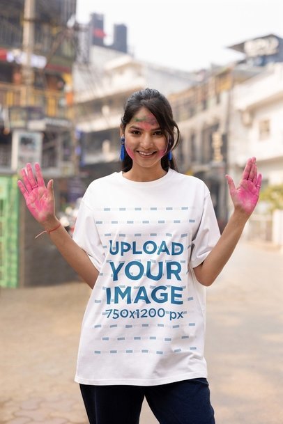 Holi Festival-Themed Blinkstore Tee Mockup of a Woman Showing Her Colored Hand Palms