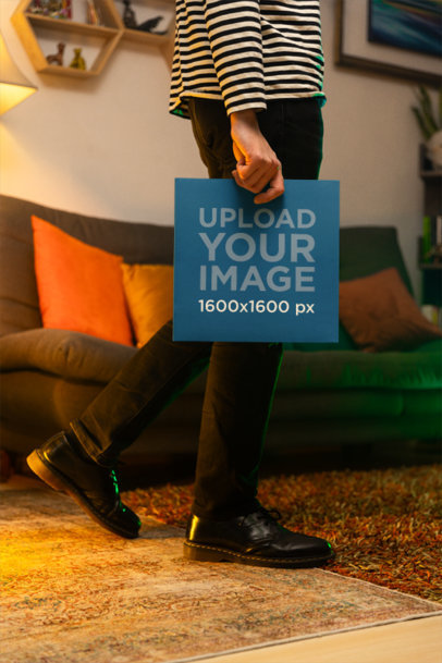 Mockup Featuring a Man Holding a Vinyl Record Cover at Home m37038