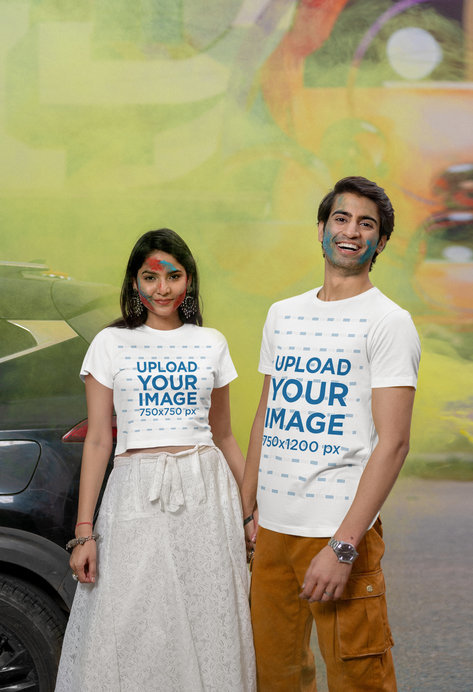 Scott International T-Shirt and Crop Top Mockup of a Smiling Couple Holding Hands for Holi Festival