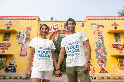 T-Shirt Mockup of a Man and a Woman Holding Hands and Celebrating the Holi Festival  m37238