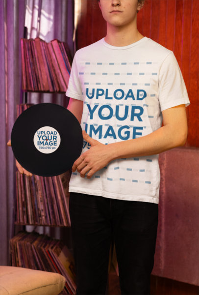 T-Shirt Mockup of a Man Holding a Classic Vinyl Record on His Hands