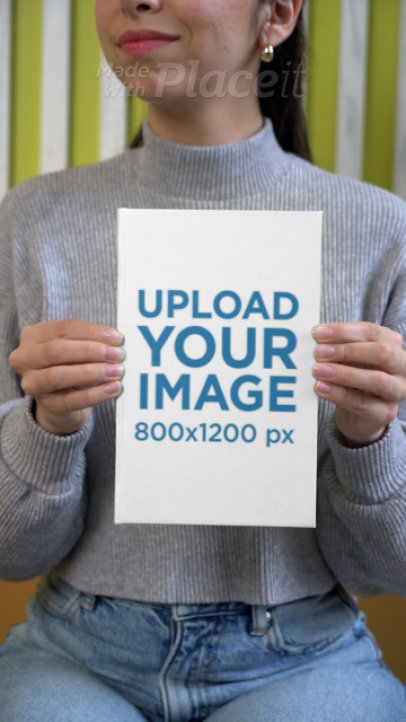 Video of a Cropped-Face Woman Holding a Hardcover Book 7612v