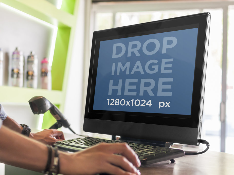 Placeit - PC Mockup of Man Using Desktop HP at Retail Counter