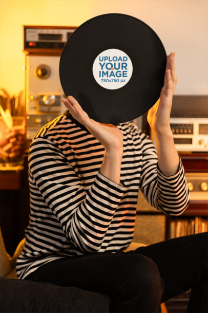 Mockup of a Man Covering His Face With a Vinyl Record