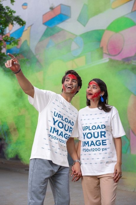 Blinkstore T-Shirt Mockup of a Happy Man and Woman With Painted Faces Celebrating Holi