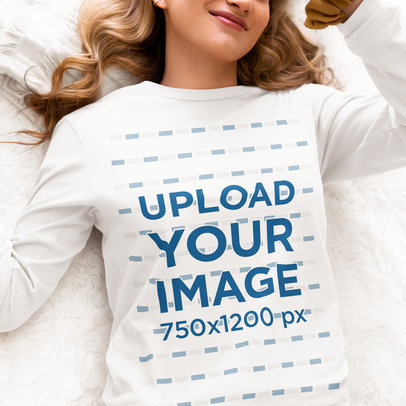 Bella Canvas Long Sleeve Tee Mockup of a Woman Lying on a Cozy Blanket