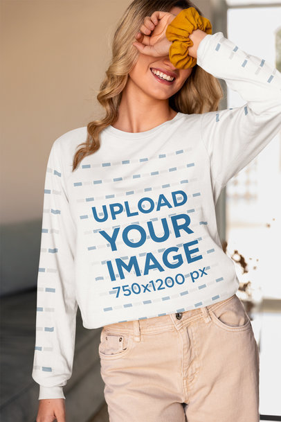 Bella Canvas Long-Sleeve Tee Mockup of a Happy Woman With a Homemade Feel Look