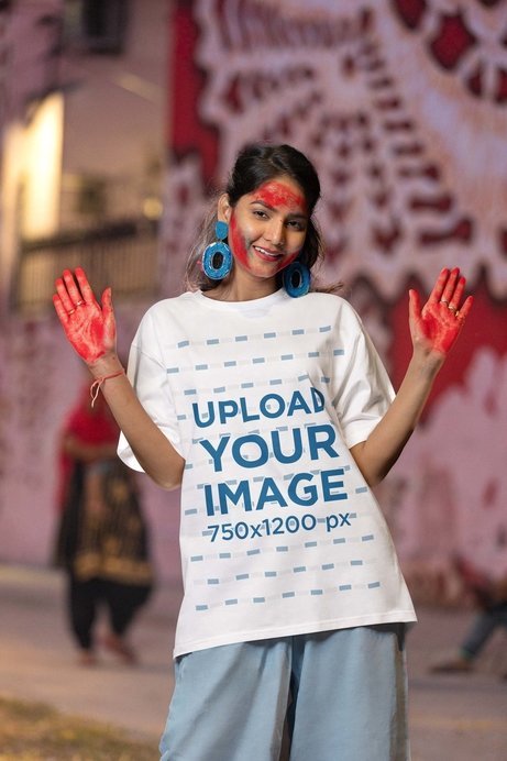 Blinkstore Tee Mockup of a Woman with a Painted Face and Hands for the Holi Festival