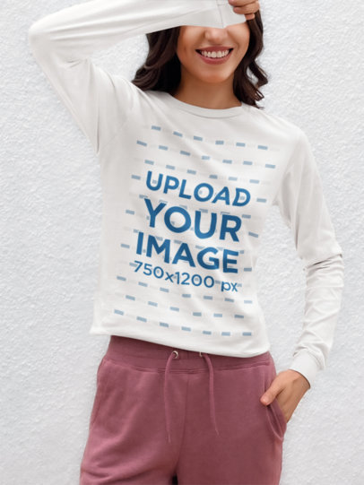 Mockup of a Smiling Cropped-Face Woman Wearing a Bella Canvas Long-Sleeve Tee