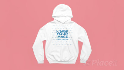 Video of a Gildan Pullover Hoodie Lying Over a Colorful Background 7608v