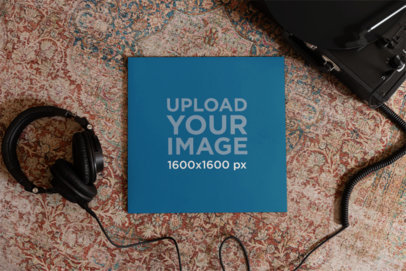 Mockup of a Vinyl Record Placed over a Vintage Rug Next to Wired Headphones m37039