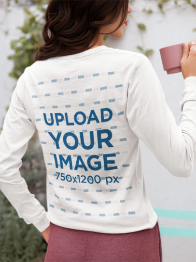 Back-View Bella Canvas Long-Sleeve Tee Mockup of a Woman Holding a Mug