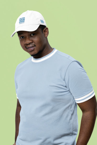 Mockup of a Man Posing in a Studio Wearing a Dad Hat from Otto Cap