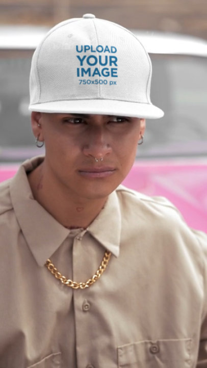 Snapback Hat Video of a Serious Tattooed Man Posing Near a Car