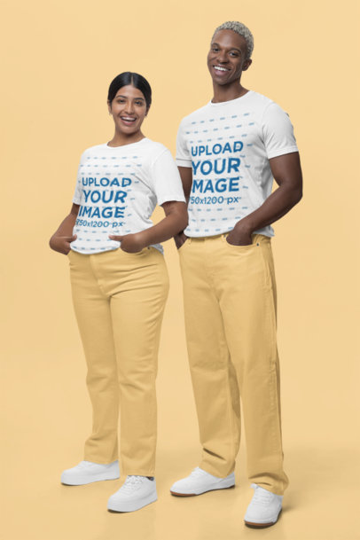 Bella Canvas Tee Mockup Featuring a Couple Wearing Gender-Neutral Outfits