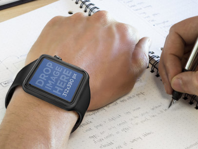 Man Using Black Apple Watch While Taking Notes