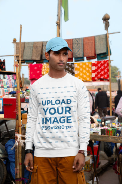 Mockup Featuring a Man Wearing a Rounded-Neck Sweatshirt at a Market