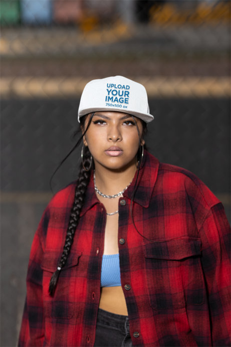 Snapback Hat Mockup Featuring a Woman with a Braid Looking into the Camera