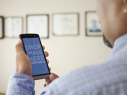 Man Using Android Phone at Doctor Waiting Room