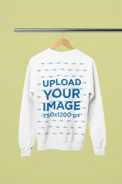 Mockup of a Rounded-Neck Gildan Sweatshirt Placed on a Wooden Hanger