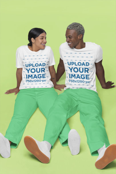 Bella Canvas T-Shirt Mockup of a Smiling Couple in Similar Gender-Neutral Outfits