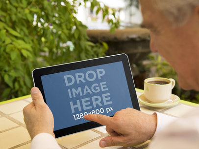 Elderly Man With Samsung Tablet at the Terrace