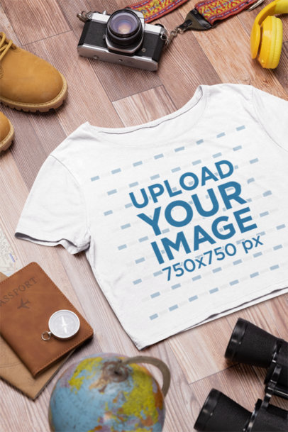 Travel Outfit-Themed Mockup Featuring a Bella Canvas Crop Top Placed on a Wooden Surface m37444
