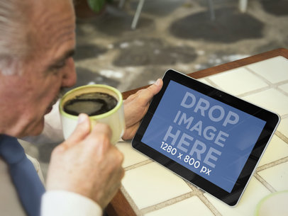 Gentleman Using Samsung Tablet While Drinking Coffee Mockup