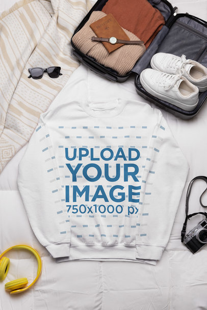 Outfit Mockup Featuring a Gildan Sweatshirt Placed on a Bed Next to a Travel Suitcase m37463